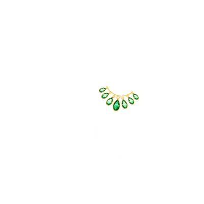Brilliant Gems Hair Studio logo featuring a gold crescent with teardrop-shaped emerald gems.